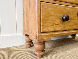 An Antique English Pine Chest of Drawers Dresser with Dark Wooden Knobs