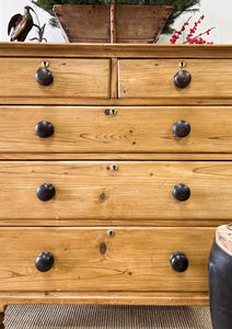 An Antique English Pine Chest of Drawers Dresser with Dark Wooden Knobs