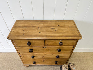 An Antique English Pine Chest of Drawers Dresser with Dark Wooden Knobs