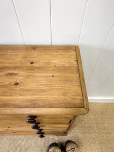 An Antique English Pine Chest of Drawers Dresser with Dark Wooden Knobs