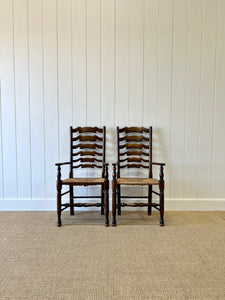 A Vintage Set of 8 English Oak Ladder Back Chairs with 2 Captain's Chairs