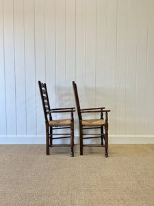 A Vintage Set of 8 English Oak Ladder Back Chairs with 2 Captain's Chairs