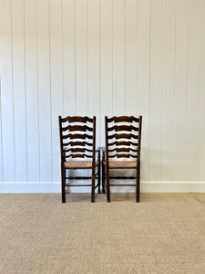 A Vintage Set of 8 English Oak Ladder Back Chairs with 2 Captain's Chairs