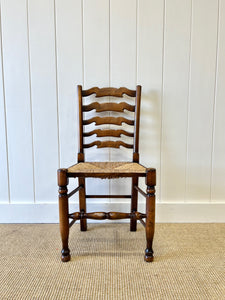 A Vintage Set of 8 English Oak Ladder Back Chairs with 2 Captain's Chairs