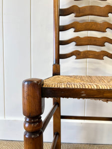 A Vintage Set of 8 English Oak Ladder Back Chairs with 2 Captain's Chairs