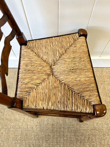 A Vintage Set of 8 English Oak Ladder Back Chairs with 2 Captain's Chairs