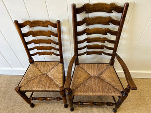 A Vintage Set of 8 English Oak Ladder Back Chairs with 2 Captain's Chairs