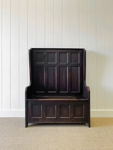 An Antique English Oak Settle with Seat Storage