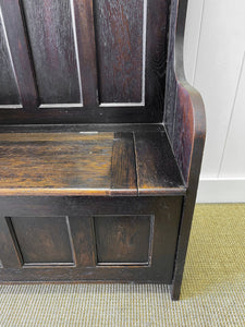 An Antique English Oak Settle with Seat Storage