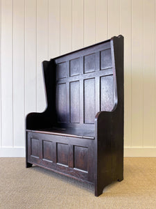 An Antique English Oak Settle with Seat Storage