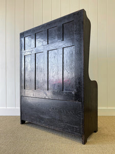 An Antique English Oak Settle with Seat Storage