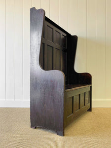 An Antique English Oak Settle with Seat Storage