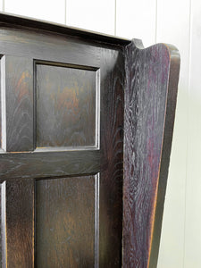 An Antique English Oak Settle with Seat Storage