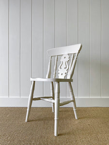 A Vintage Set of 8 Fiddleback Chairs