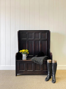 An Antique English Oak Settle with Seat Storage