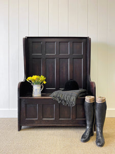 An Antique English Oak Settle with Seat Storage