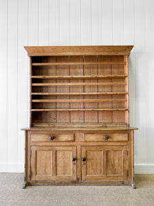 An Early 19th Century Pine Irish Dresser or Cupboard with Wooden Knobs