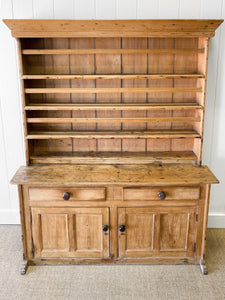 An Early 19th Century Pine Irish Dresser or Cupboard with Wooden Knobs