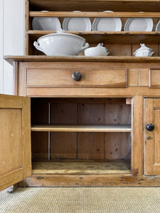 An Early 19th Century Pine Irish Dresser or Cupboard with Wooden Knobs