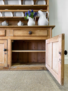 An Early 19th Century Pine Irish Dresser or Cupboard with Wooden Knobs