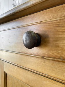 An Early 19th Century Pine Irish Dresser or Cupboard with Wooden Knobs