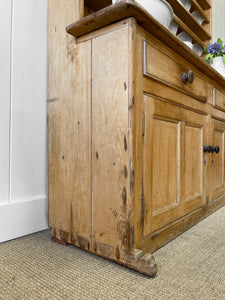 An Early 19th Century Pine Irish Dresser or Cupboard with Wooden Knobs
