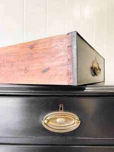 An Ebonized Antique English Chest of Drawers/Dresser