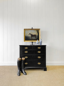 An Ebonized Antique English Chest of Drawers/Dresser