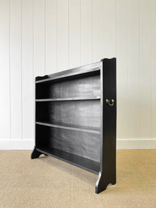 An English Ebonized Waterfall Bookcase