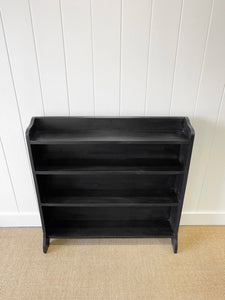 An English Ebonized Waterfall Bookcase