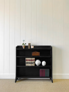 An English Ebonized Waterfall Bookcase