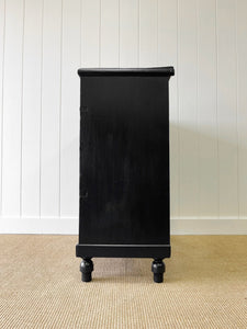 An Ebonized Antique English Chest of Drawers/Dresser with Light Knobs