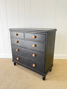 An Ebonized Antique English Chest of Drawers/Dresser with Light Knobs