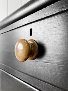 An Ebonized Antique English Chest of Drawers/Dresser with Light Knobs