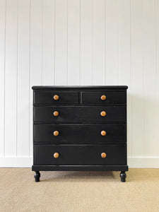 An Ebonized Antique English Chest of Drawers/Dresser with Light Knobs
