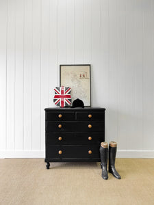 An Ebonized Antique English Chest of Drawers/Dresser with Light Knobs