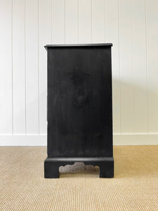 An Ebonized Antique English Chest of Drawers/Dresser