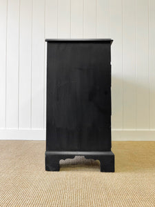 An Ebonized Antique English Chest of Drawers/Dresser