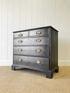 An Ebonized Antique English Chest of Drawers/Dresser