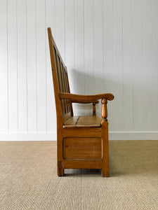 An Antique English 19th Century Pine Settle