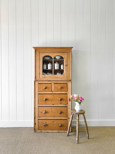 A Narrow Pine 19th Century Cupboard with Glazed Door