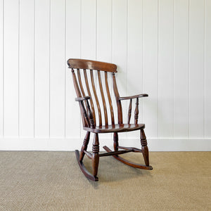 A Victorian Beech Slat Back Windsor Farmhouse Rocking Chair