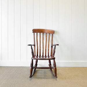 A Victorian Beech Slat Back Windsor Farmhouse Rocking Chair
