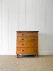 A 19th Century Bow Front English Chest of Drawers