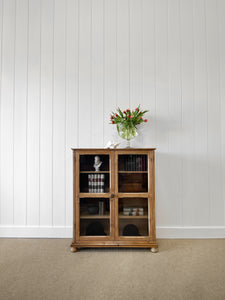 A 19th Century English Pine Glazed Bookcase on Bun Feet