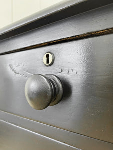 An Ebonized Antique English Chest of Drawers/Dresser