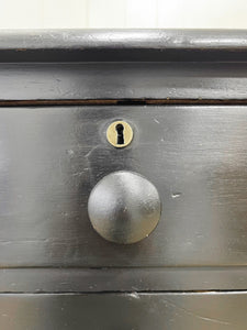 An Ebonized Antique English Chest of Drawers/Dresser
