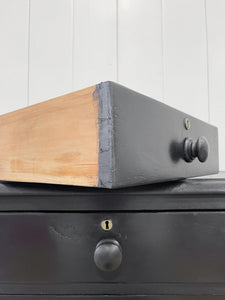 An Ebonized Antique English Chest of Drawers/Dresser
