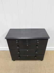 An Ebonized Antique English Chest of Drawers/Dresser