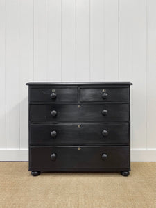 An Ebonized Antique English Chest of Drawers/Dresser